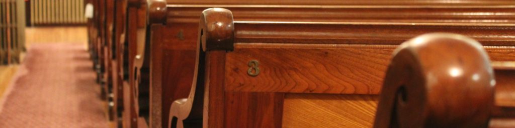 Pews in the sanctuary, part of South Baptist Church announcements